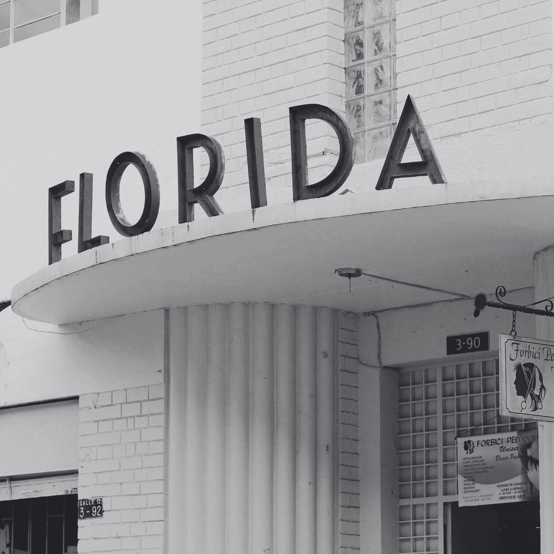 Black and white photo of a building with 'FLORIDA' on the facade